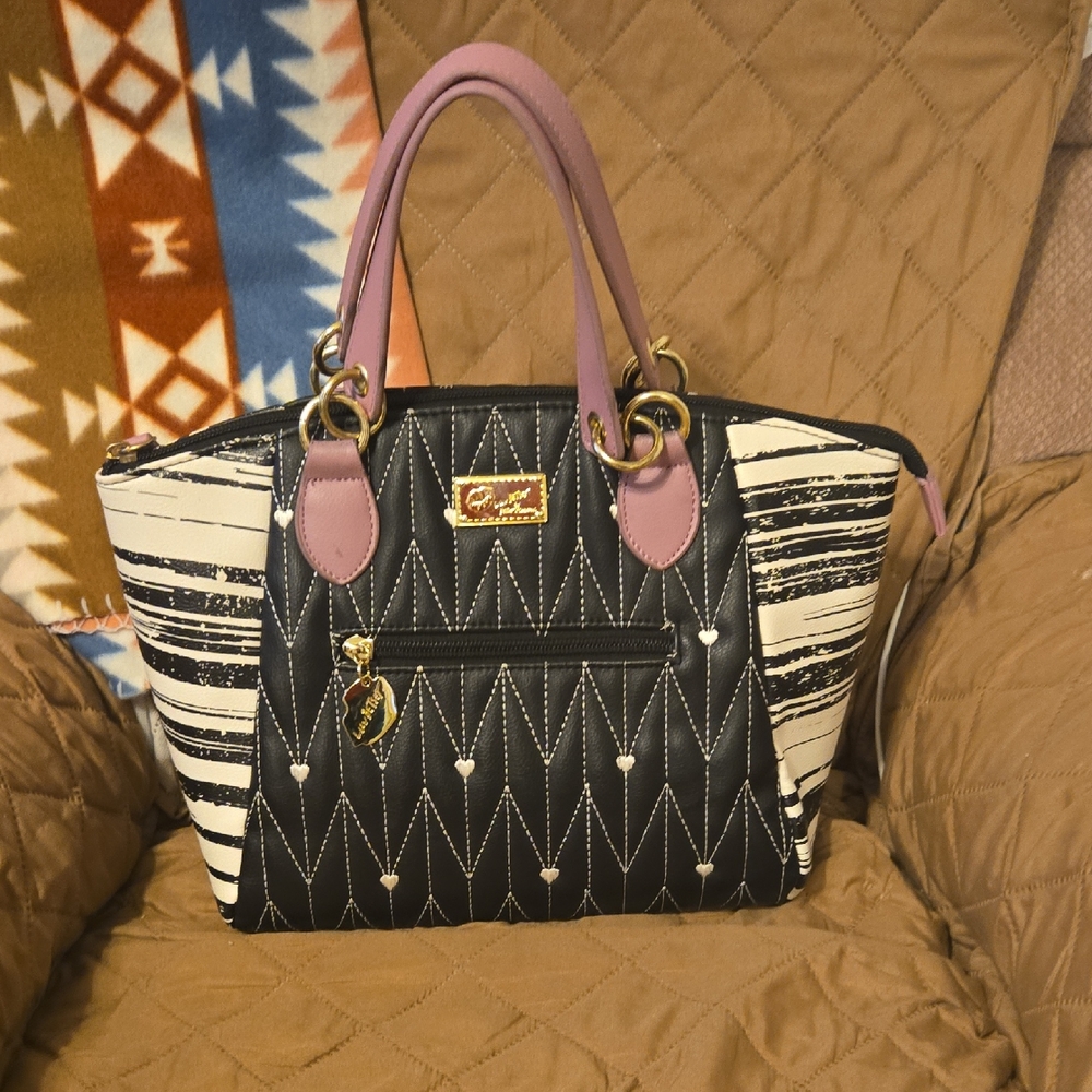 Elegant Black and White Satchel with Purple Accents